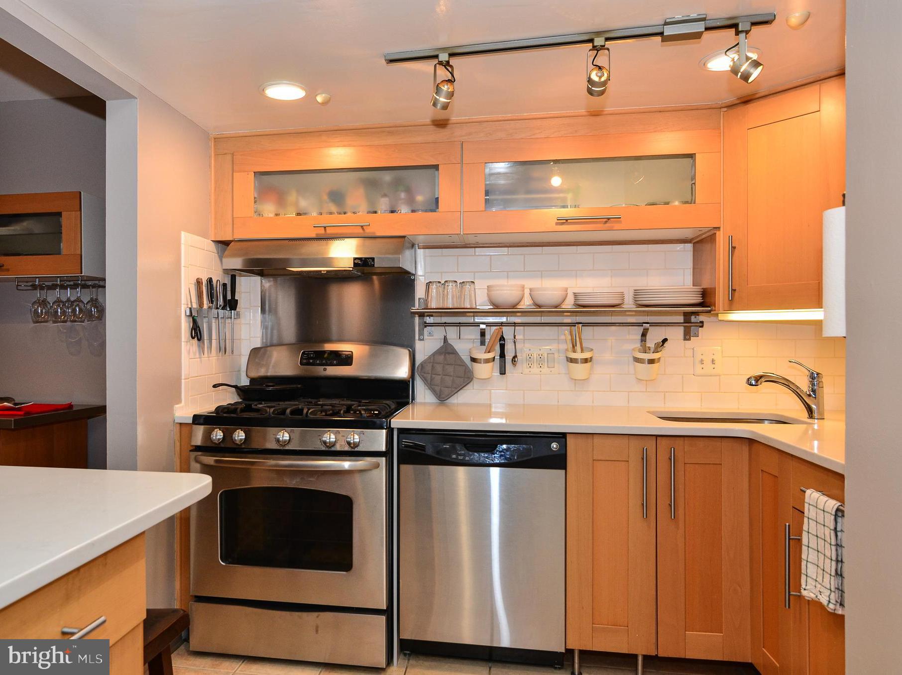 1406 Northgate Square, Unit 1A Reston, VA 20190 - Photo 2 of 38 Kitchen with stainless steel and quartz counters