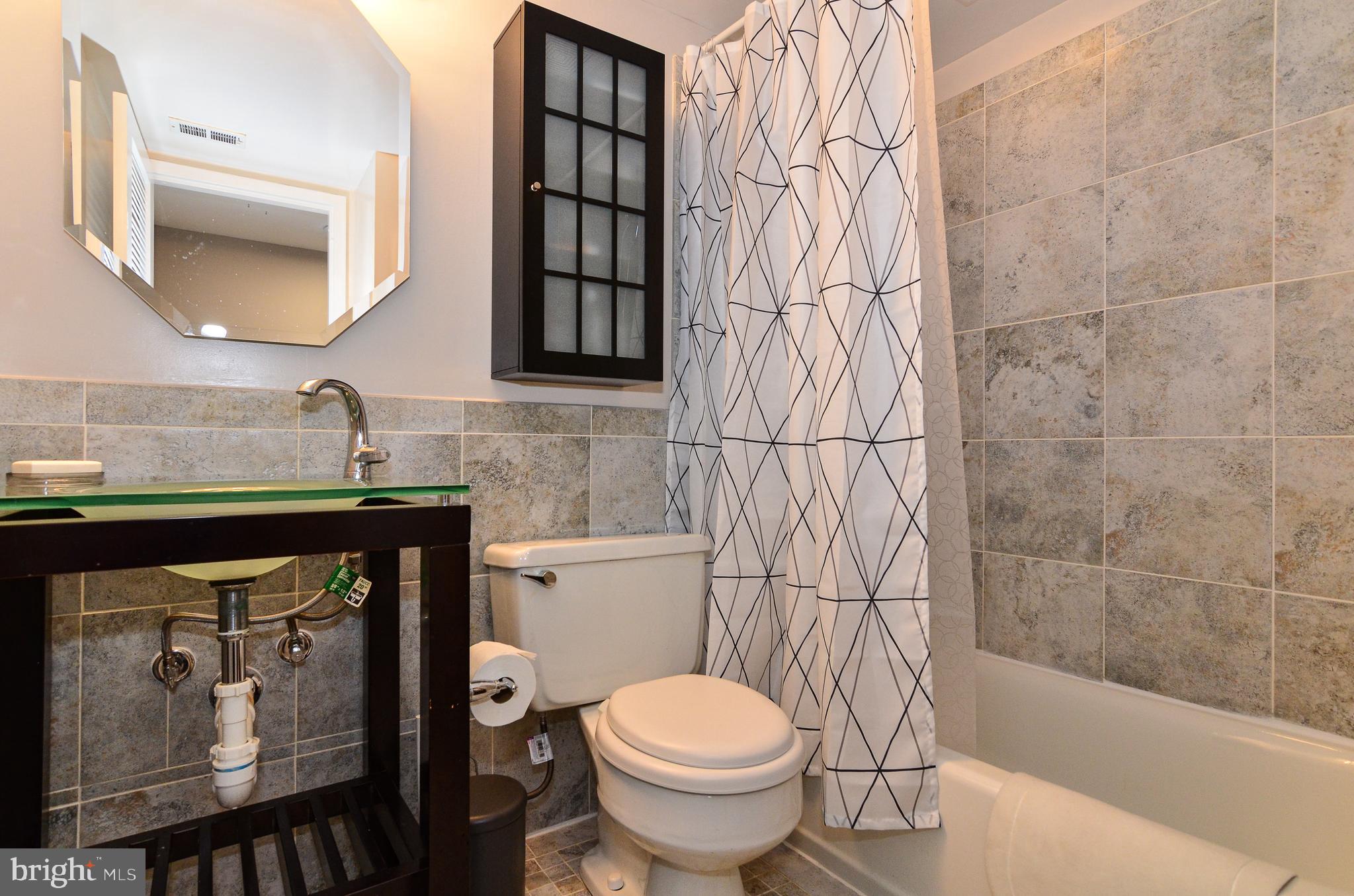 1406 Northgate Square, Unit 1A Reston, VA 20190 - Photo 15 of 38 Updated bathroom