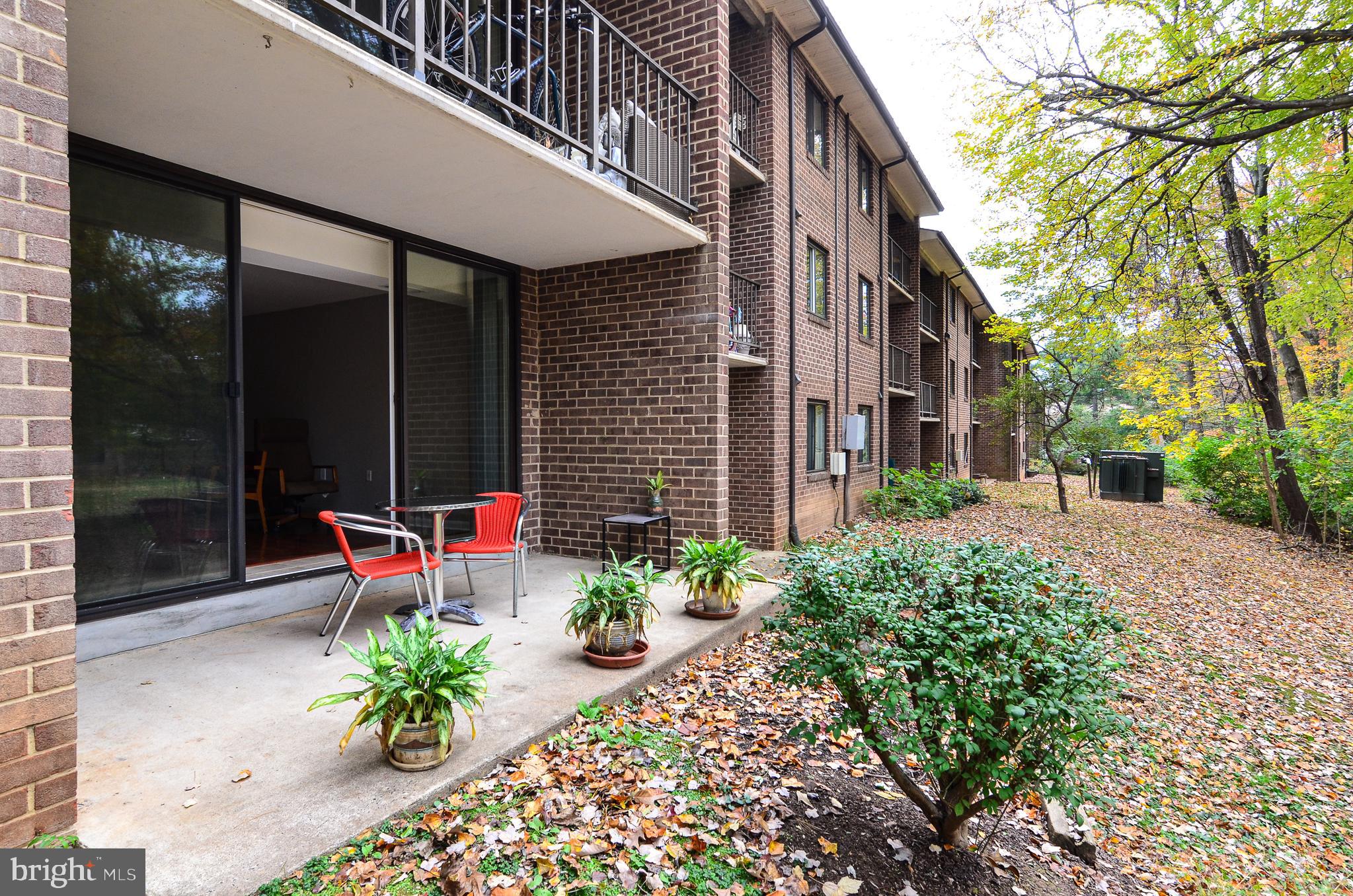 1406 Northgate Square, Unit 1A Reston, VA 20190 - Photo 18 of 38 Enjoy the quiet common area from the patio
