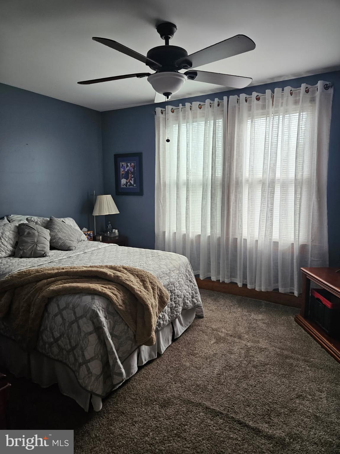 3911 4th Street Baltimore, MD 21225 - Photo 16 of 18 a bedroom with a bed and a window