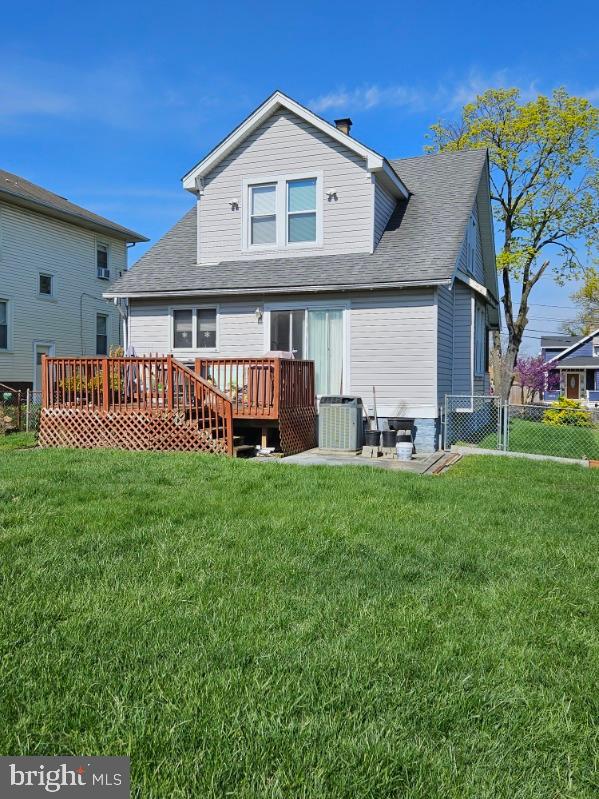 3911 4th Street Baltimore, MD 21225 - Photo 3 of 18 a front view of a house with garden