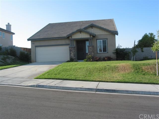 20588 Azalea Terrace Road Riverside, CA 92508 - Photo 1 of 1 a front view of a house with a yard and garage