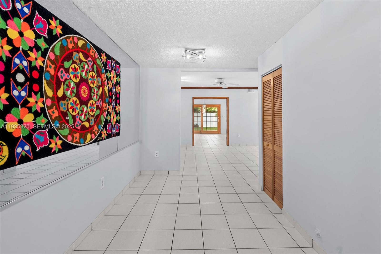 10922 Southwest 25th Street Miami, FL 33165 - Photo 3 of 33 a view of entryway with wooden floor