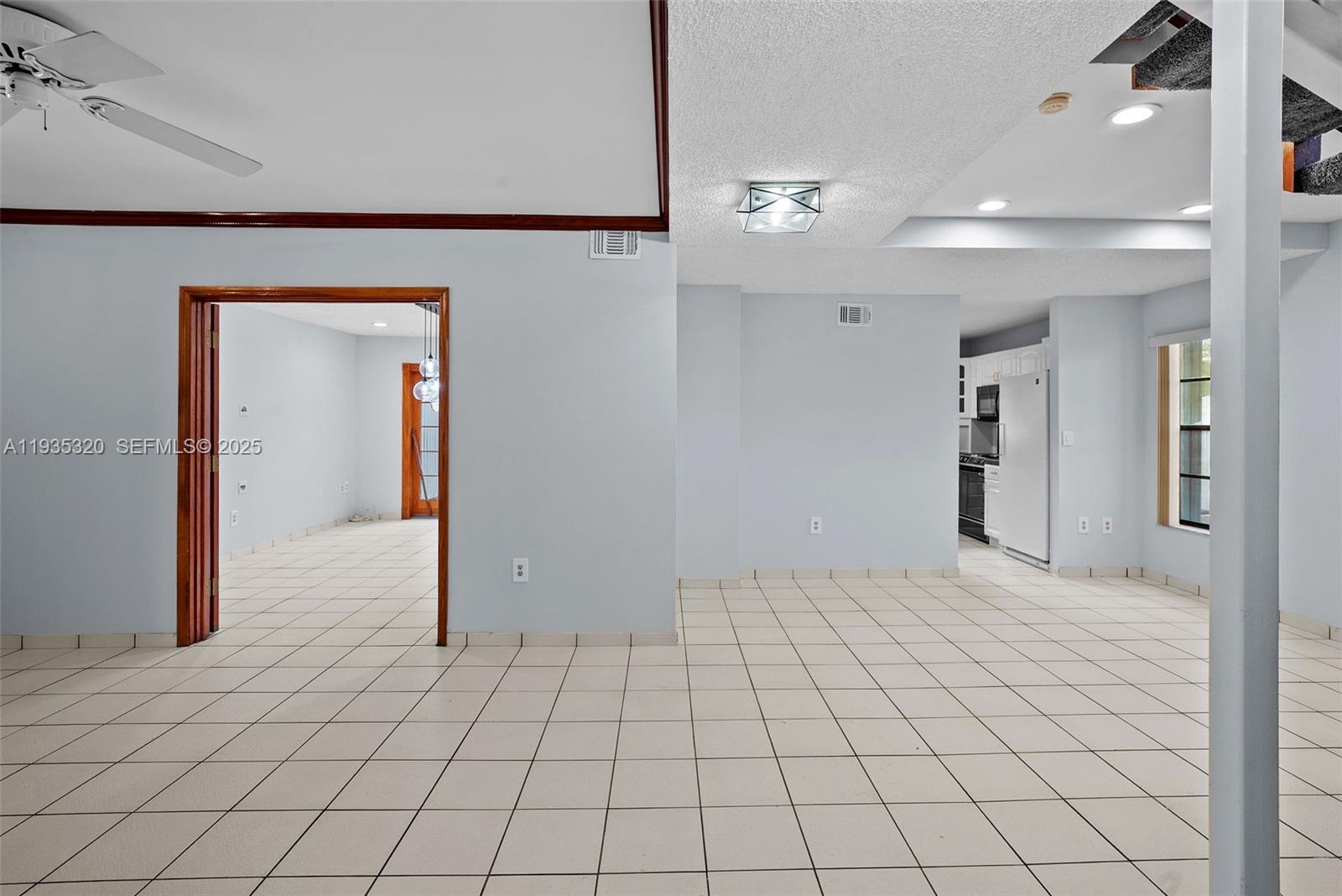 10922 Southwest 25th Street Miami, FL 33165 - Photo 6 of 33 a view of an empty room