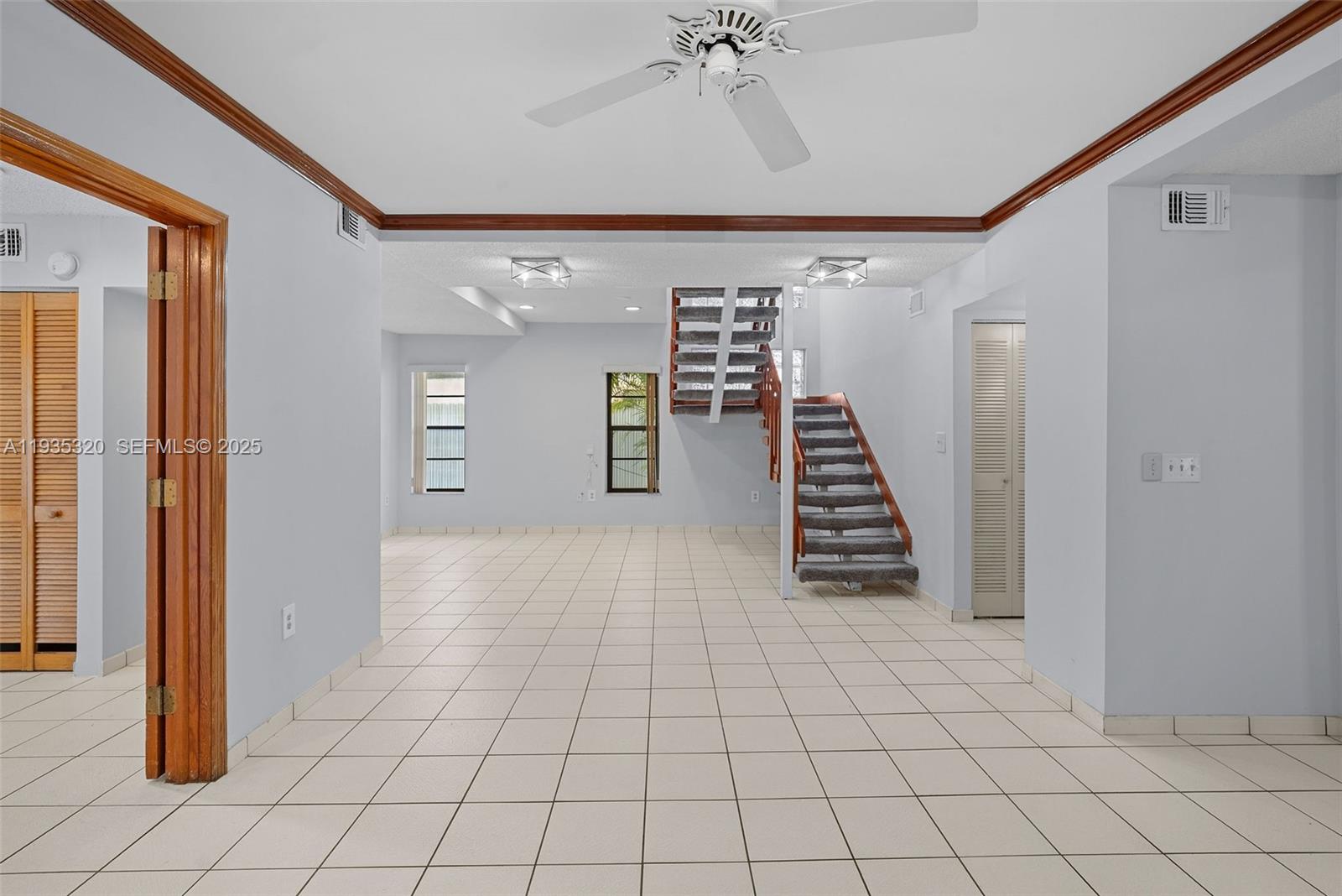 10922 Southwest 25th Street Miami, FL 33165 - Photo 7 of 33 a view of an entryway with staircase