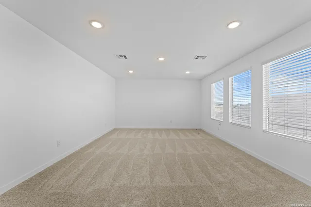 an empty room with a natural light