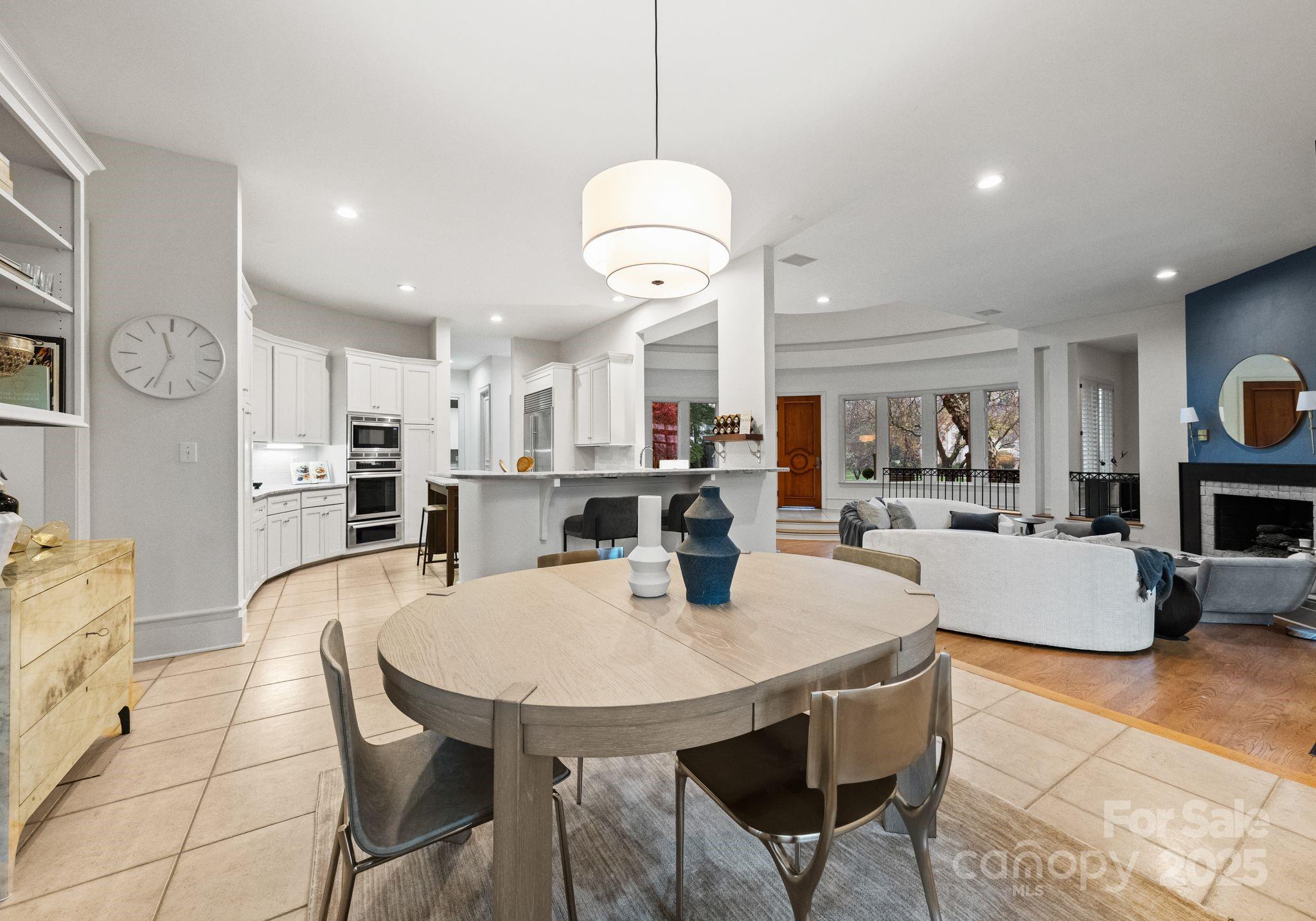 8813 Covey Rise Court Charlotte, NC 28226 - Photo 12 of 47 a view of a dining room with furniture