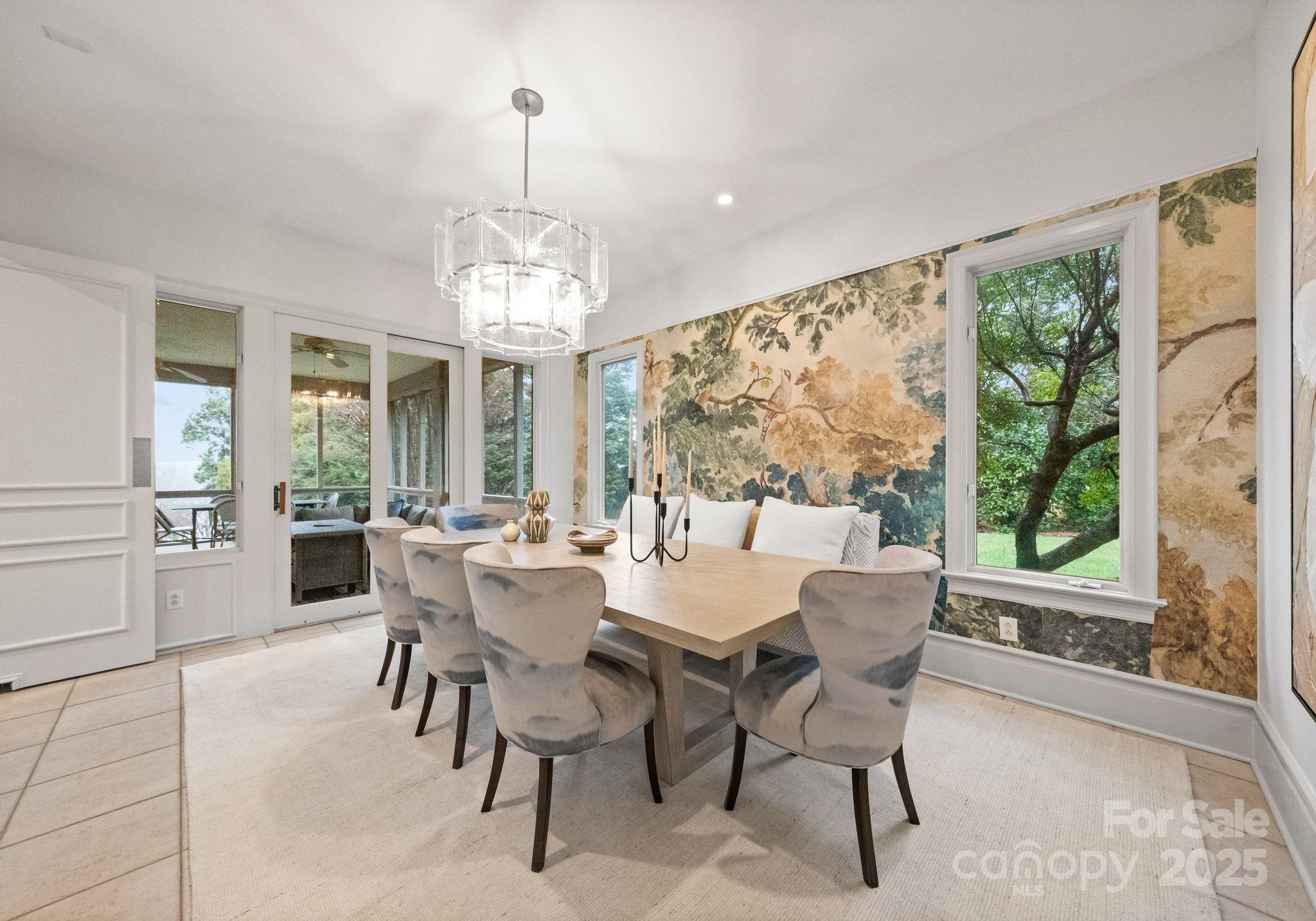8813 Covey Rise Court Charlotte, NC 28226 - Photo 18 of 47 a view of a dining room with furniture large windows and wooden floor