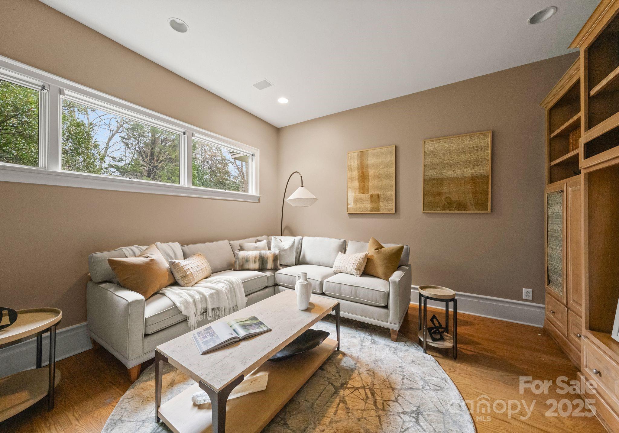 8813 Covey Rise Court Charlotte, NC 28226 - Photo 19 of 47 a living room with furniture and a window