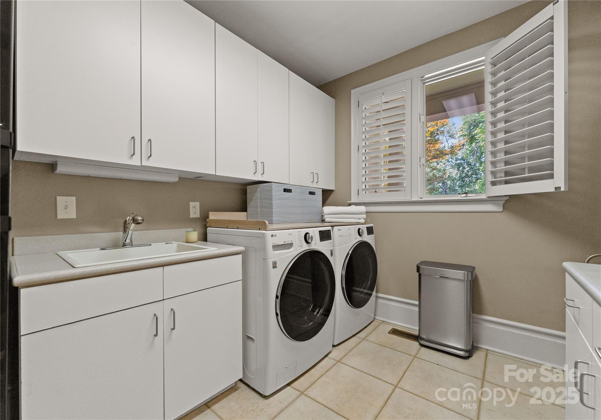 8813 Covey Rise Court Charlotte, NC 28226 - Photo 20 of 47 a utility room with sink dryer and washer