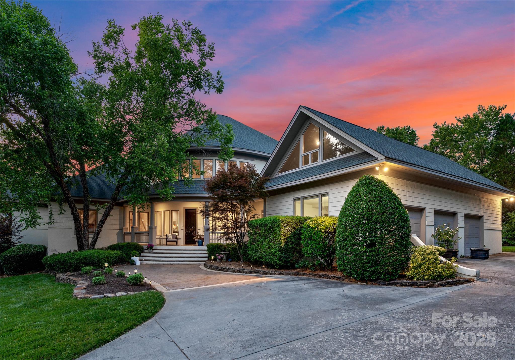 8813 Covey Rise Court Charlotte, NC 28226 - Photo 2 of 47 a front view of a house with a yard and potted plants