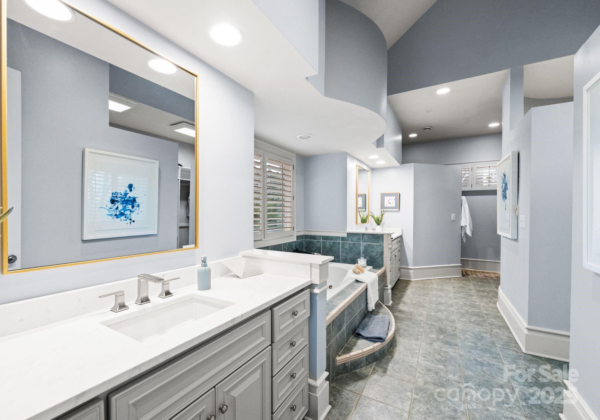 8813 Covey Rise Court Charlotte, NC 28226 - Photo 24 of 47 a spacious bathroom with a double vanity sink and a mirror