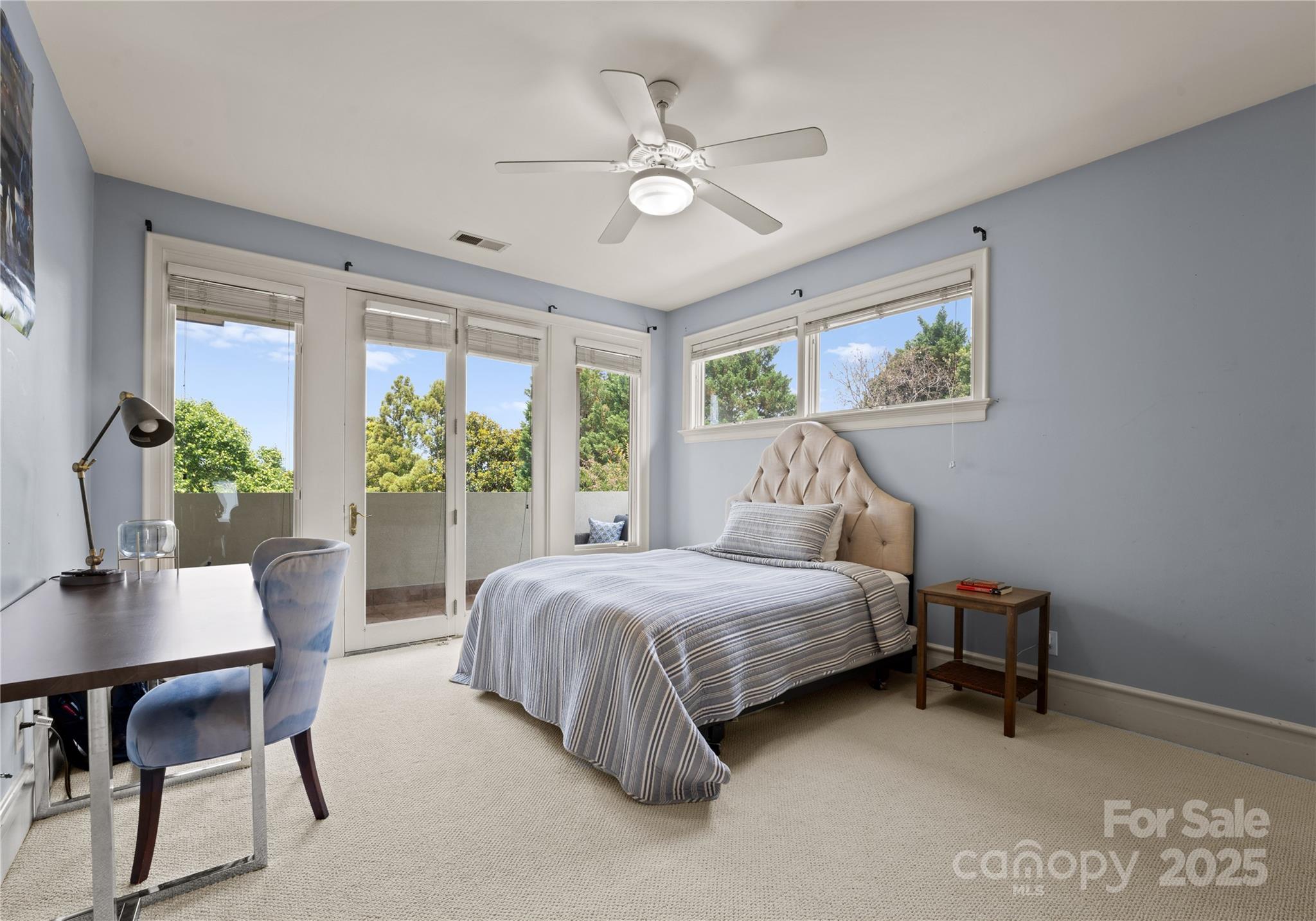 8813 Covey Rise Court Charlotte, NC 28226 - Photo 28 of 47 a spacious bedroom with a bed table and a large window