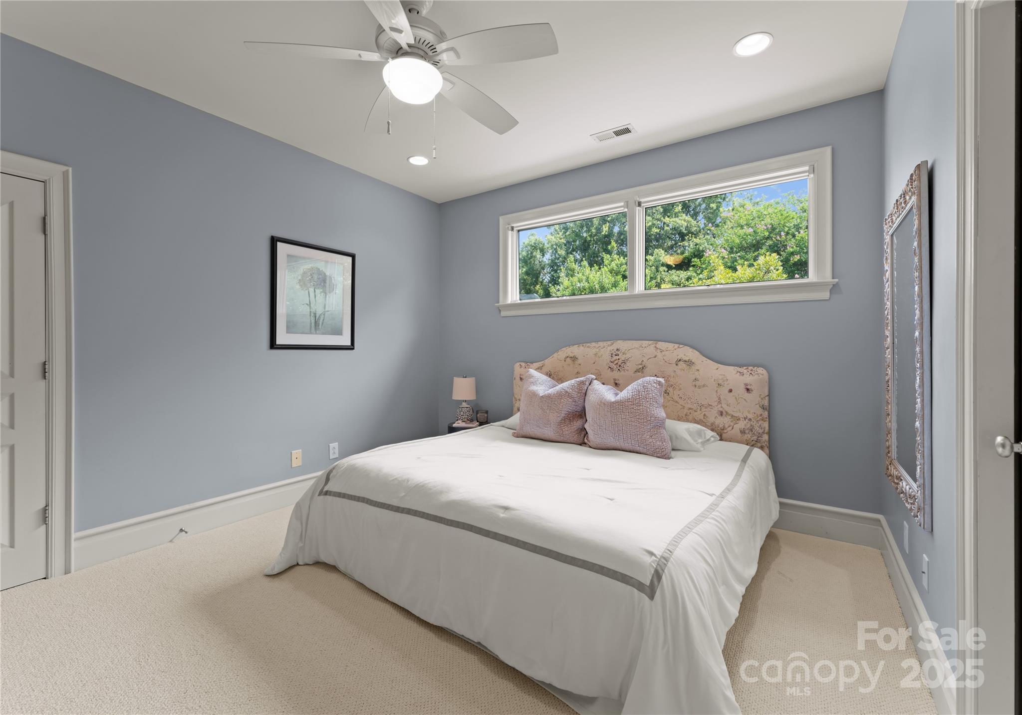 8813 Covey Rise Court Charlotte, NC 28226 - Photo 30 of 47 a bedroom with a large bed and a window