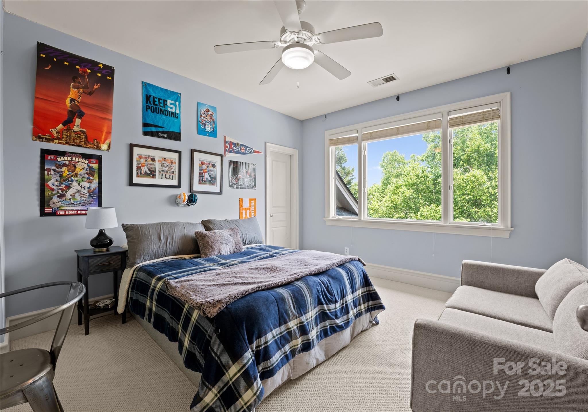 8813 Covey Rise Court Charlotte, NC 28226 - Photo 32 of 47 a bedroom with a bed a couch and a window