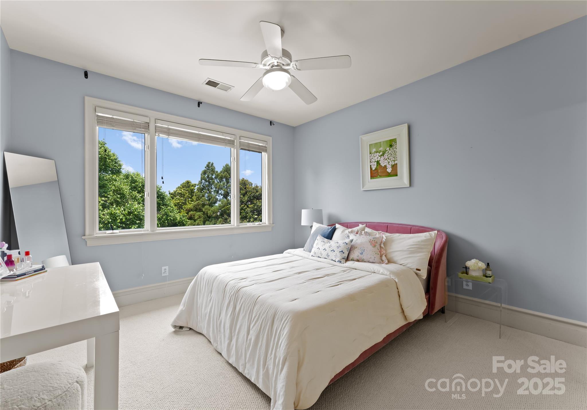 8813 Covey Rise Court Charlotte, NC 28226 - Photo 33 of 47 a bedroom with a large bed and a large window