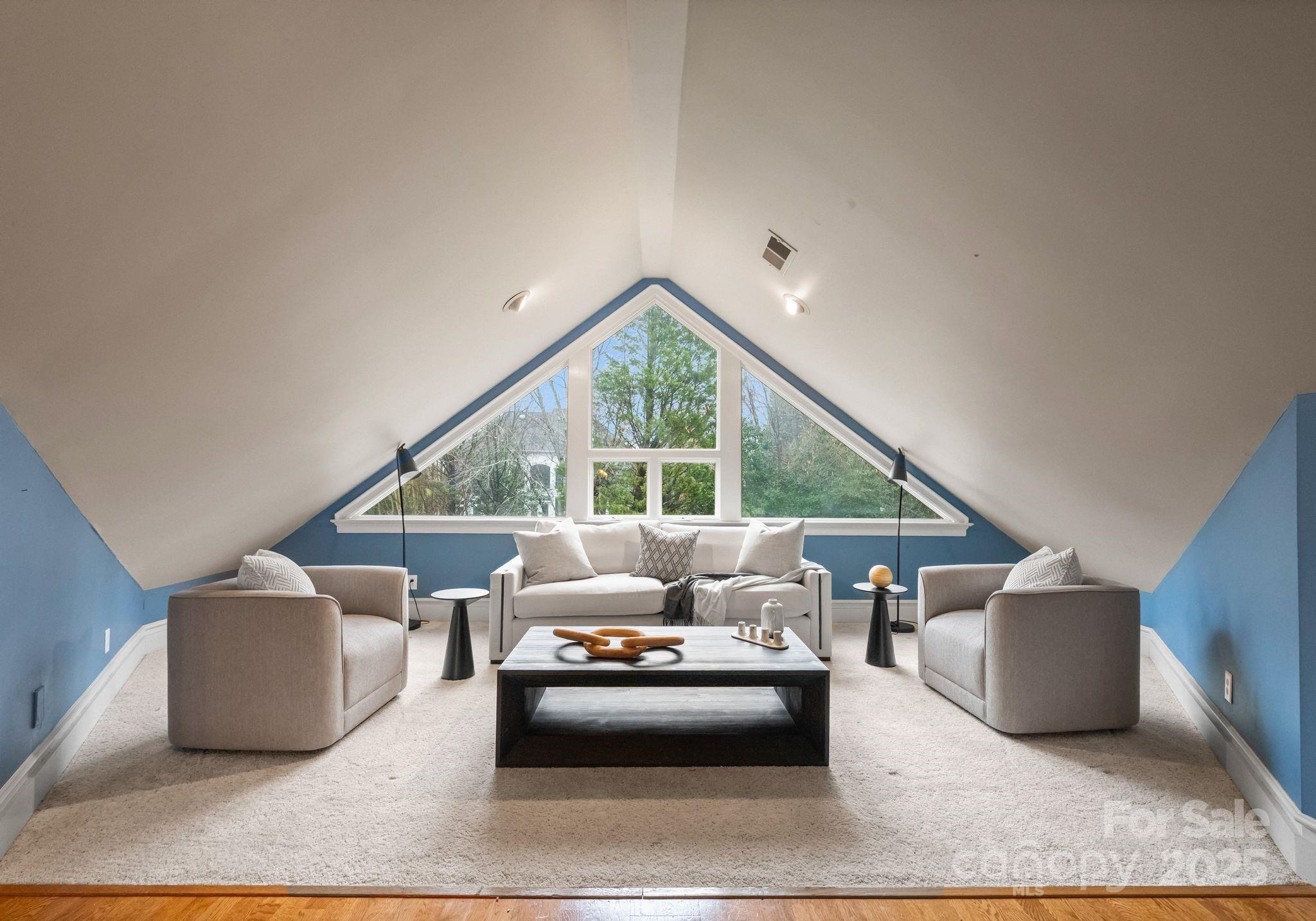 8813 Covey Rise Court Charlotte, NC 28226 - Photo 36 of 47 a living room with furniture and a large window