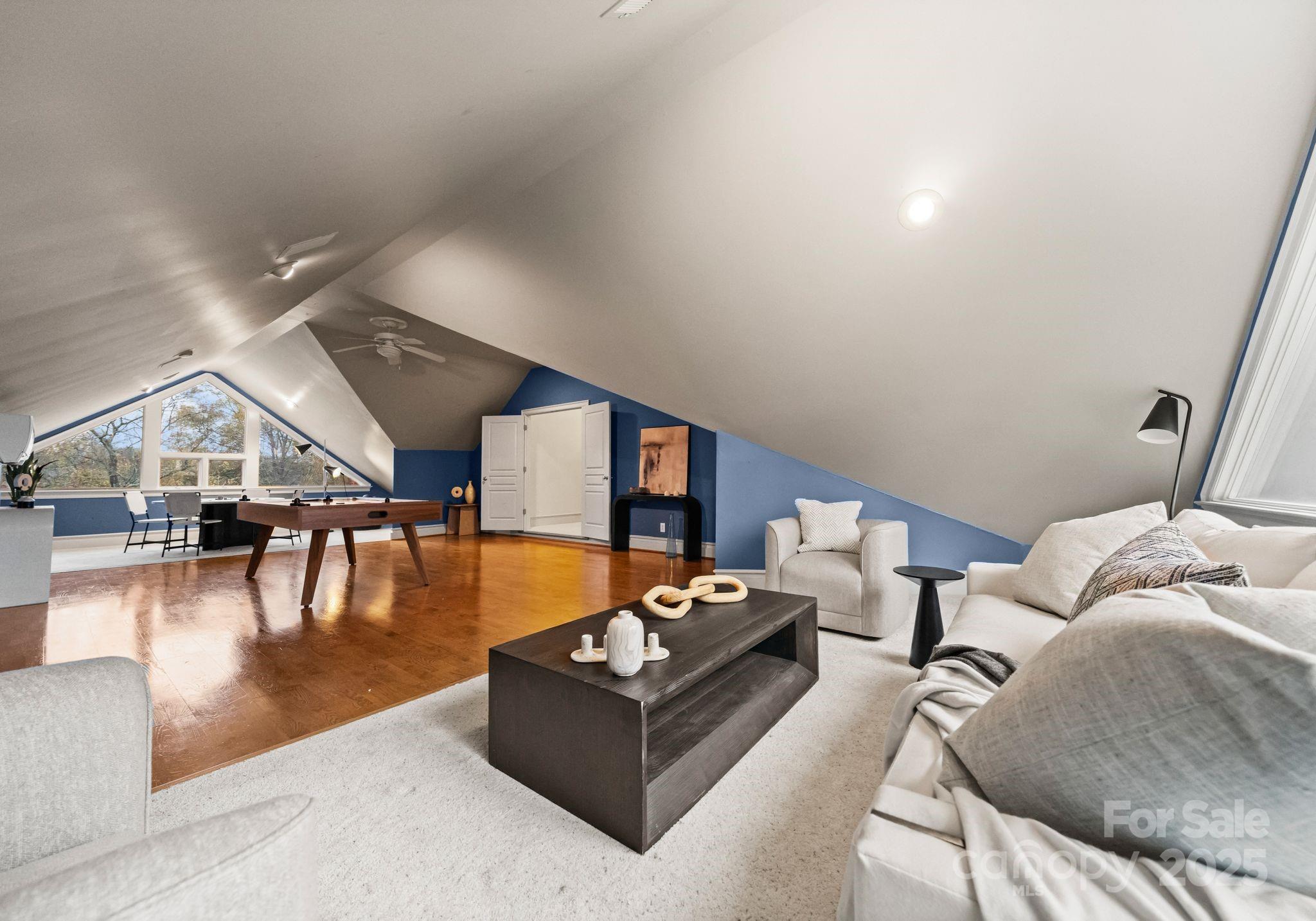 8813 Covey Rise Court Charlotte, NC 28226 - Photo 37 of 47 a living room with furniture and a table with potted plants