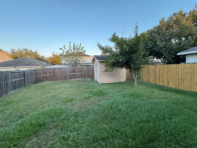 a view of a backyard with a garden