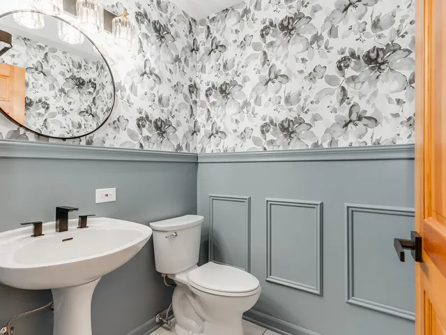 a bathroom with a toilet and a sink