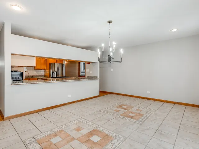 a view of a kitchen with a sink and cabinets