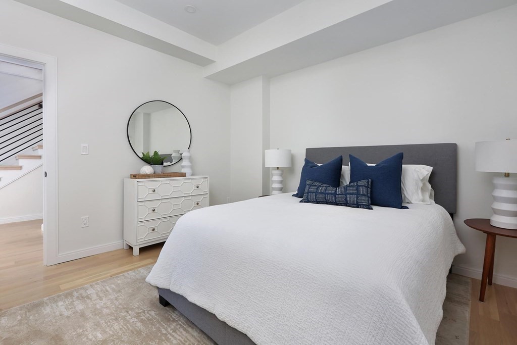 41 Summit Avenue, Unit 41 Brookline, MA 02446 - Photo 13 of 20 a bedroom with a bed and a dresser