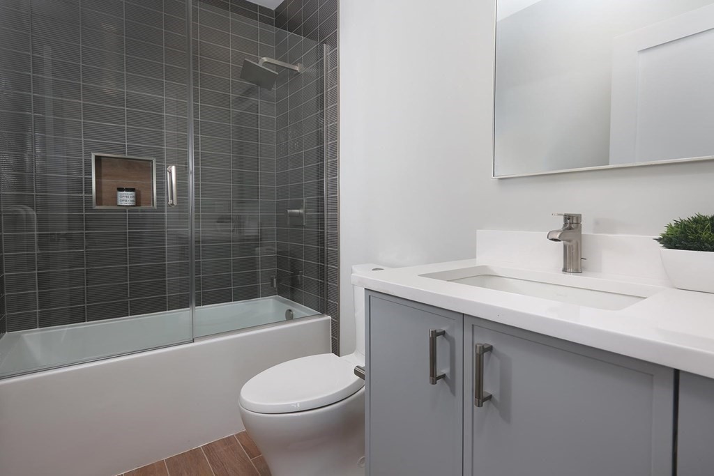 41 Summit Avenue, Unit 41 Brookline, MA 02446 - Photo 17 of 20 a bathroom with a sink a toilet and shower