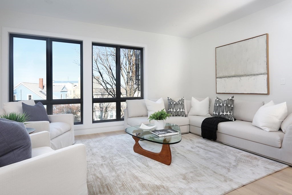 41 Summit Avenue, Unit 41 Brookline, MA 02446 - Photo 6 of 20 a living room with furniture and a large window