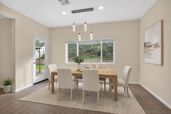 a view of a dining room with furniture window and outside view