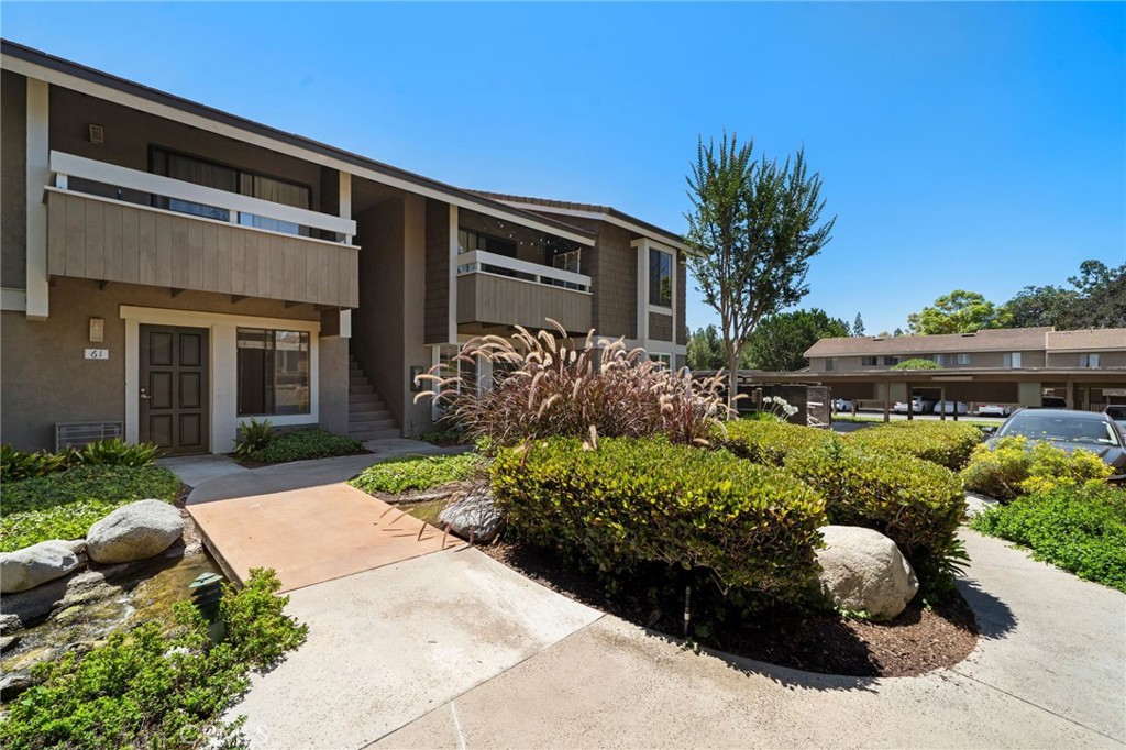 63 Streamwood Irvine, CA 92620 - Photo 3 of 36 Lush green landscaping throughout the community