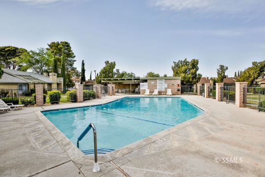 1023 North Norma Street Ridgecrest, CA 93555 - Photo 30 of 32 a view of a swimming pool with an outdoor seating