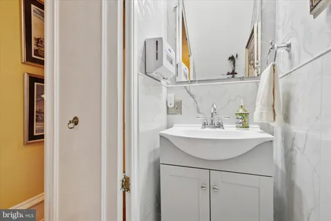a en suite bathroom with a sink a mirror and a shower