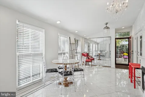 a kitchen with stainless steel appliances kitchen island granite countertop a stove a sink and a microwave