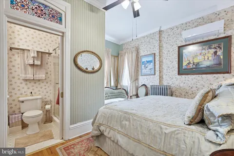a bathroom with a granite countertop sink and mirror