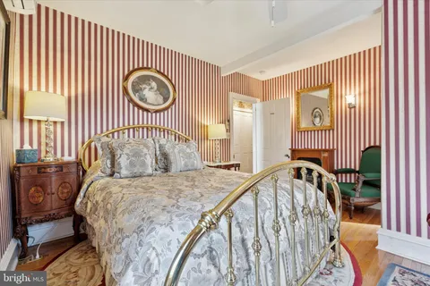 a dining room with furniture and a chandelier