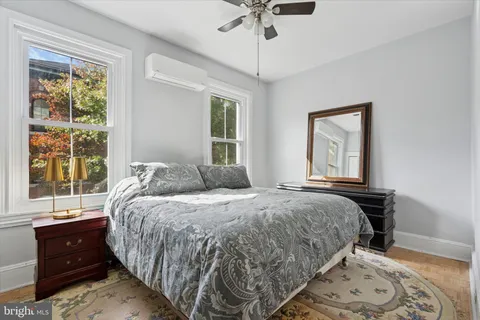 a car parked in front of a brick house