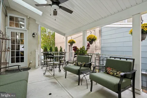 a living room with fireplace furniture and a chandelier