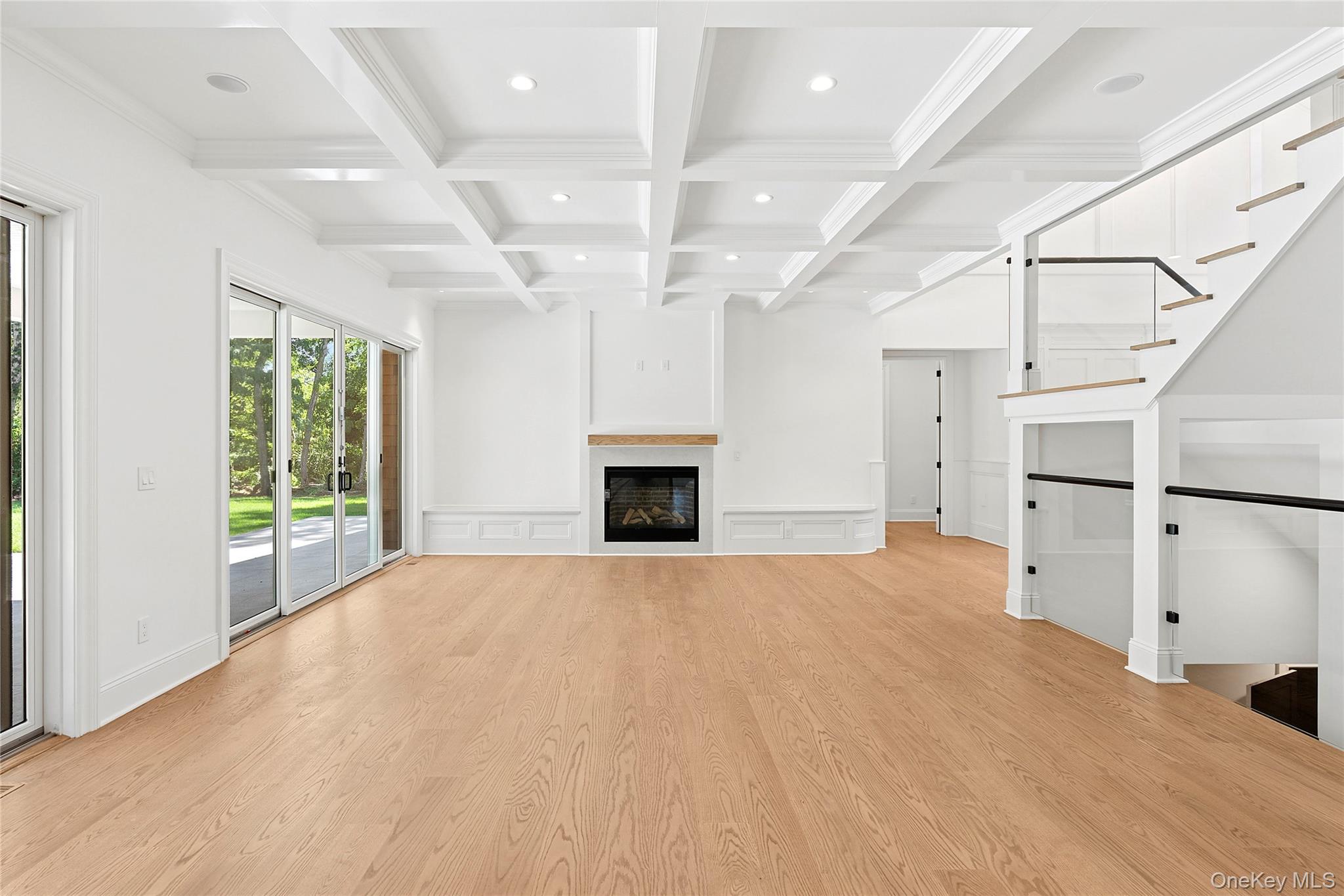 80 Deer Run Southold, NY 11971 - Photo 11 of 29 a view of an empty room with a fireplace and a window