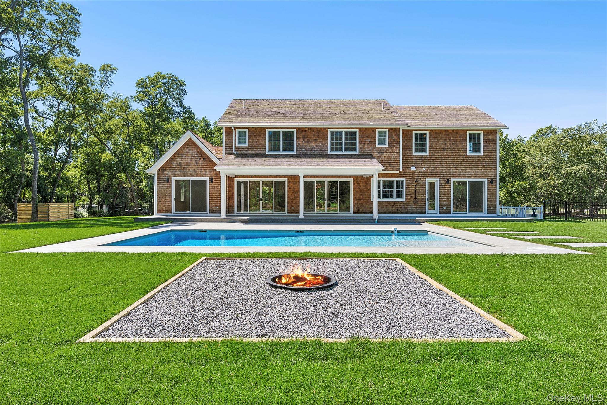 80 Deer Run Southold, NY 11971 - Photo 3 of 29 a house with swimming pool in front of it