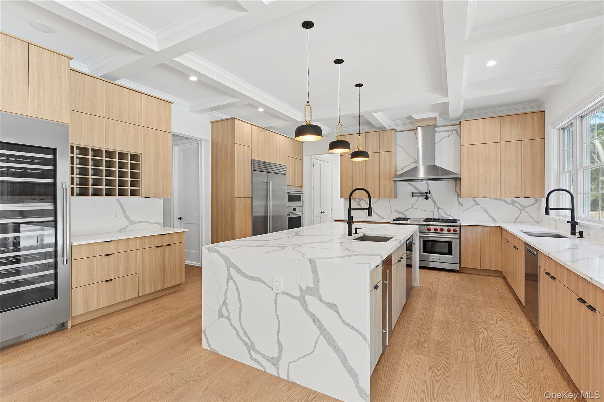 80 Deer Run Southold, NY 11971 - Photo 7 of 29 a large kitchen with kitchen island a sink a stove a refrigerator and white cabinets