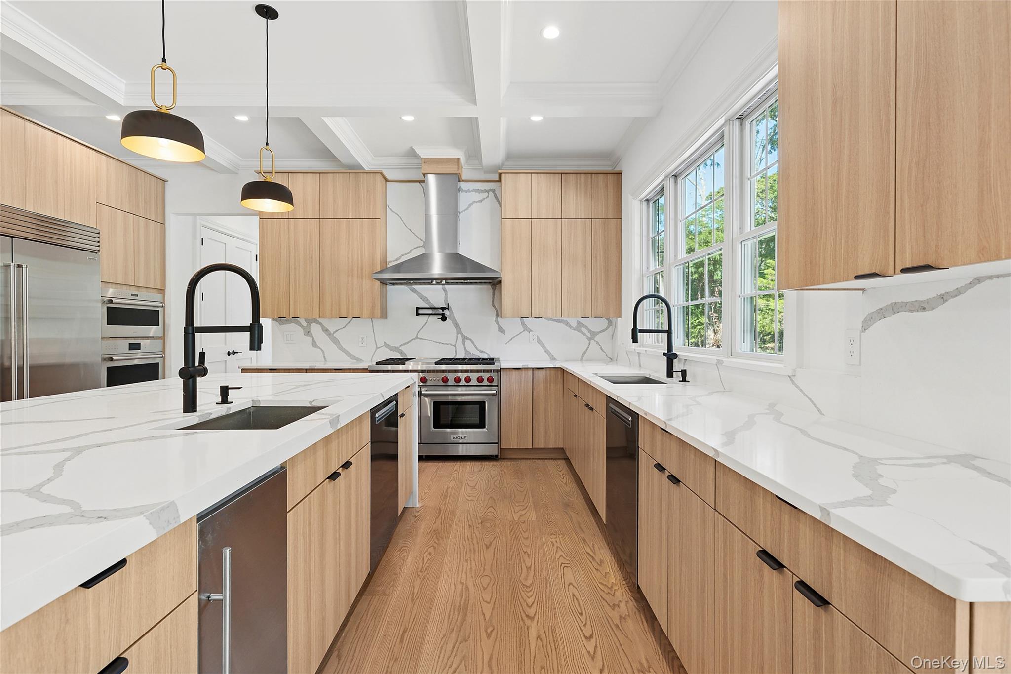 80 Deer Run Southold, NY 11971 - Photo 8 of 29 a kitchen with a sink a counter top space and stainless steel appliances