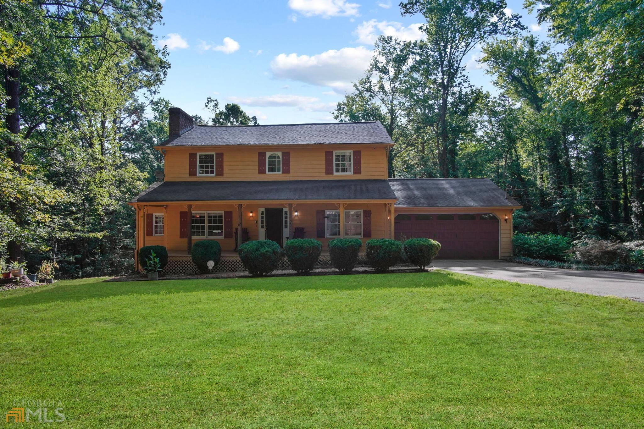 6770 Tell Road Fairburn, GA 30213 - Photo 1 of 1 a front view of a house with a yard