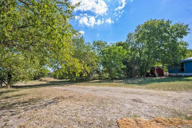 a backyard of a house with lots of green space