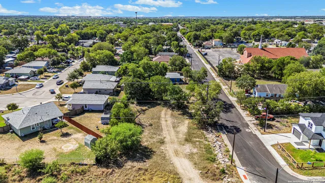 an aerial view of residential houses with outdoor space