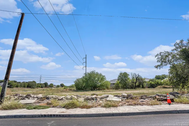 a view of a road with a building in the background