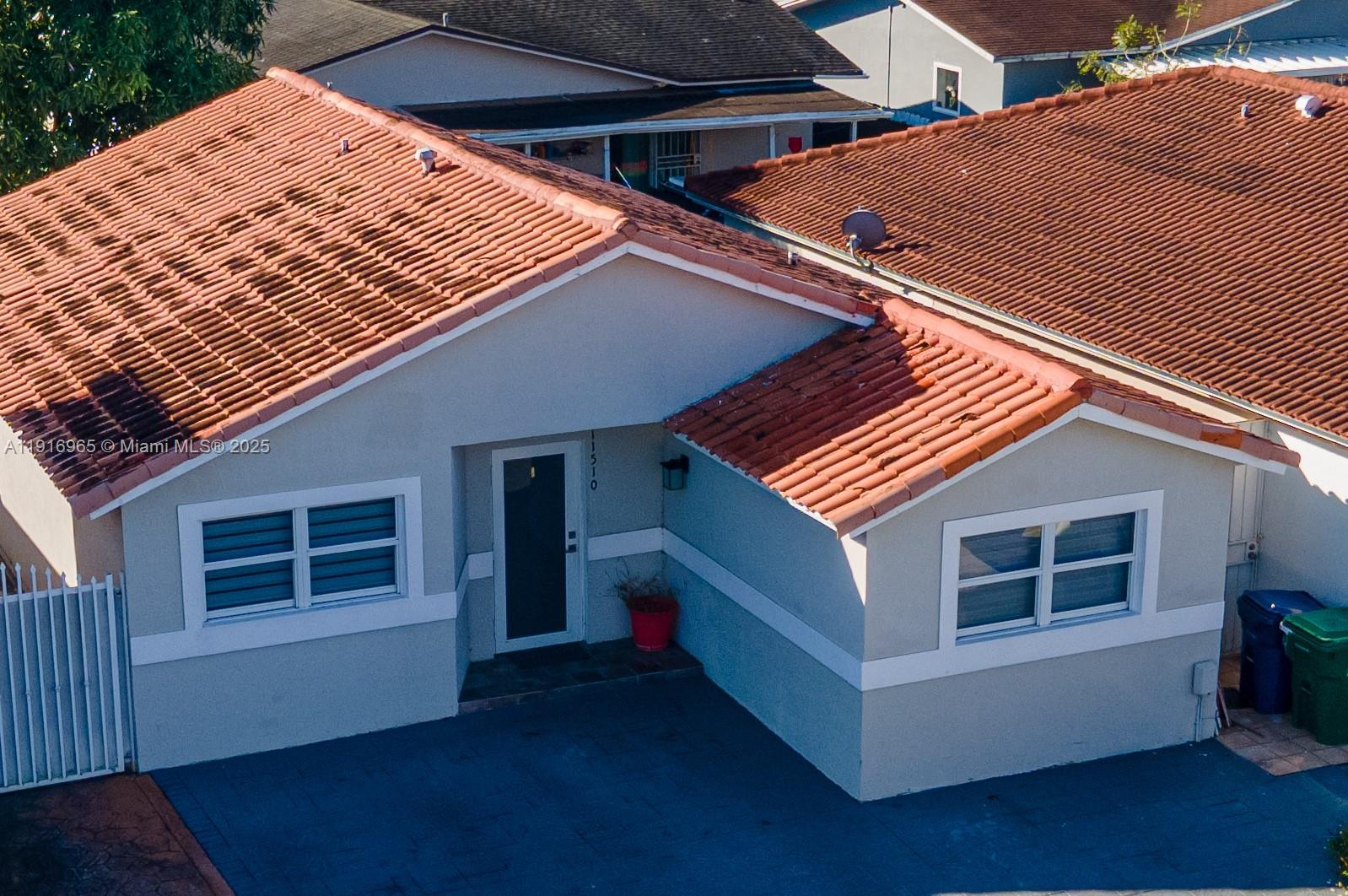 a view of backyard with deck and wooden floor