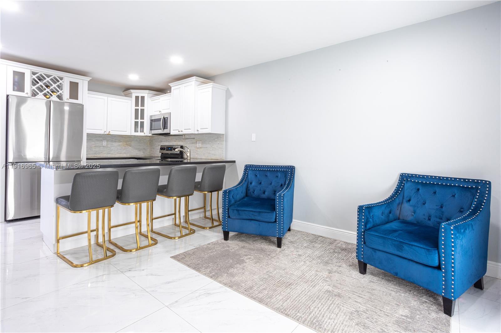 11510 Southwest 7th Street Sweetwater, FL 33174 - Photo 2 of 17 a living room with furniture and a refrigerator