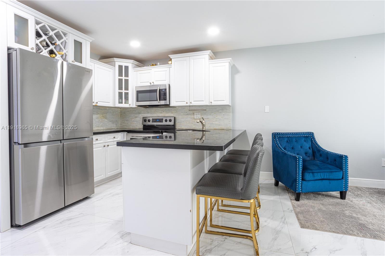 11510 Southwest 7th Street Sweetwater, FL 33174 - Photo 3 of 17 a kitchen with stainless steel appliances granite countertop a refrigerator a stove a sink and a refrigerator