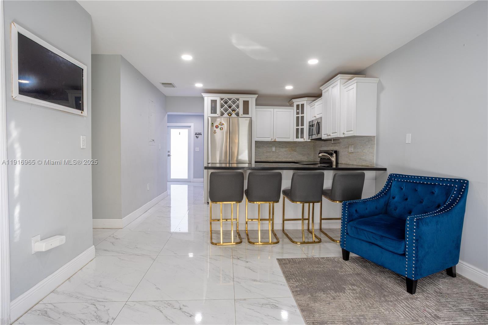 11510 Southwest 7th Street Sweetwater, FL 33174 - Photo 6 of 17 a living room with furniture and a flat screen tv