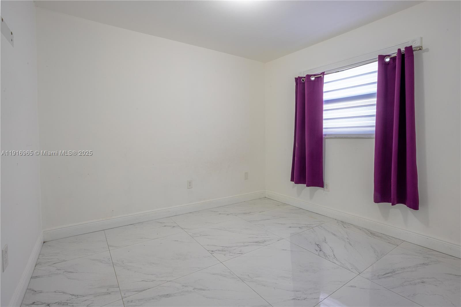 11510 Southwest 7th Street Sweetwater, FL 33174 - Photo 10 of 17 an empty room with windows and closet